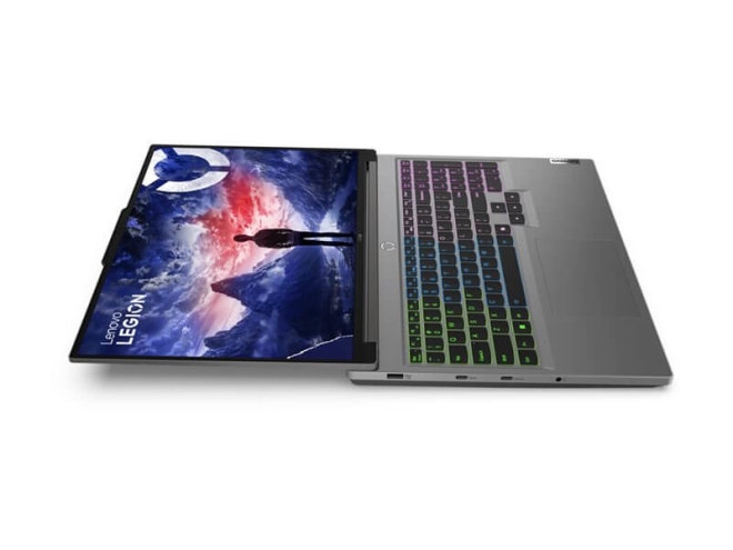 Copy electronic vam predstavlja Laptop LENOVO Legion 5 i7-14650HX 16", 16GB, 1TB, RTX 4060 8GB, [83DG002ASC]. Na fotografiji je srebrni laptop, koji je otvren pod kutom od 180 stupnjeva. Postavljen je tako da se vidi lijeva bočna strana. Tipkovnica ima pozadinsko osvjetljenje koje je u boji,od zelene do ljubičaste.